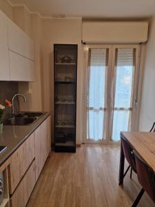 a kitchen with a sink and a counter top at In Piazza Pompeii in Pompei +7 photos