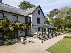 an exterior view of a house with a patio at Hazelhurst in Sway