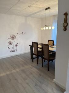a dining room with a table and chairs at Manni's Home in Munderkingen +14 photos