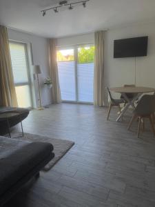 a living room with a table and chairs at Lingen Stay 2 in Lingen