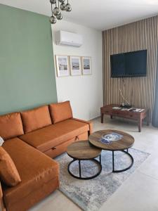 a living room with a couch and a table at Studio apartmen in Budapest