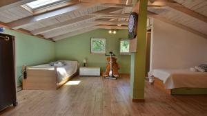a bedroom with two beds and a vaulted ceiling at Villa Skala by Villas Guide in Novi Vinodolski