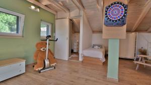 a room with a teddy bear and a dart board at Villa Skala by Villas Guide in Novi Vinodolski