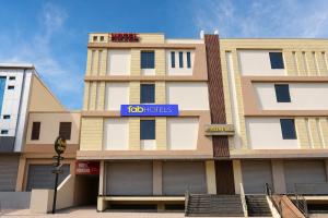 a building with a sign that reads hotels at FabHotel Aqueens Plaza - Near Jawahar Circle, Patrika Gate in Siroli