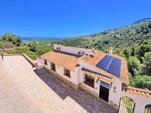 an image of a house with solar panels on the roof at Holiday Home Del Azahar by Interhome in Monte Pego +20 photos