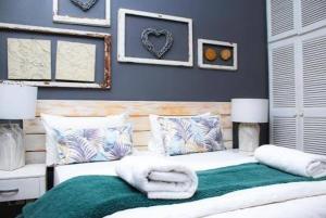 a bedroom with a bed with towels on it at Heavens stay in Vosburg