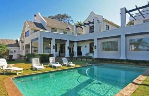 a large house with a swimming pool in the yard at Heavens stay in Vosburg