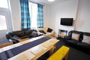 a living room with a couch and a table at William Street North in Chesterfield