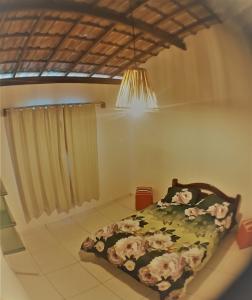 Un pat sau paturi într-o cameră la Sossego de Jaua