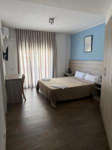 a hotel room with a bed and a window at Pensió Costa Brava in Sant Antoni de Calonge +13 photos