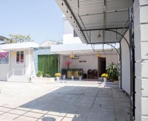 a building with awning over a courtyard at New Sala Homestay in Hue