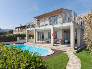 a villa with a swimming pool and a house at Villa Ca'n Tugores by Rentallorca in Colonia de Sant Pere
