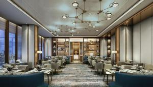 a restaurant with tables and chairs and a chandelier at Mandarin Oriental Makati, Manila in Manila