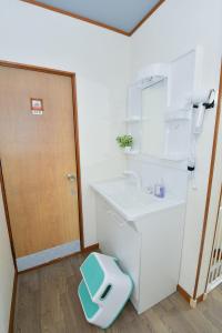 a bathroom with a sink and a toilet at Re-home in Izunokuni +41 photos