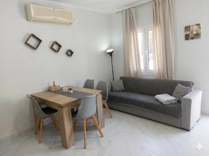 a living room with a couch and a table at Electra Gaios Apartment in Gaios +1 photo