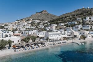 an aerial view of a beach with white buildings at White island rooms in Panteli