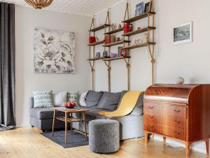 a living room with a couch and a table at Apartment Alegränd by Interhome in Falkenberg