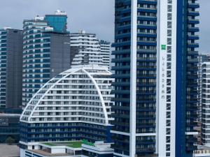 a group of tall buildings in a city at ibis Styles Batumi Hotel in Batumi