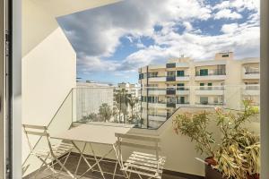 a balcony with a view of a building at Vila Baleira Residence in Funchal