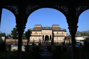 a building seen through the gates of a building at Koolwal Kothi Zinc Journey by The Fern, Nawalgarh, Rajasthan in Nawalgarh