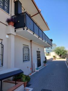 a side view of a building with a balcony at Harmony Suite in Aprilia