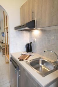 a kitchen with a sink and a counter top at Mochlos Studios in Mochlos
