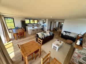 a living room with a couch and a table at Pourquoi Pas B&B in Sark