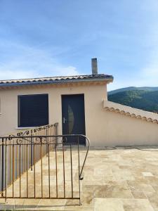 a house with a gate on the side of it at Gite Aubanel' Drôme Provencale in Saint-Auban-sur-Ouvèze +7 photos