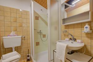 a bathroom with a shower and a sink and a toilet at Ca Contina in Val Verzasca - Happy Rentals in Frasco +28 photos