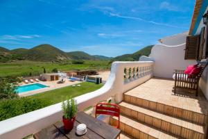 a villa with a view of the pool and mountains at Casa Fajara in Carrapateira