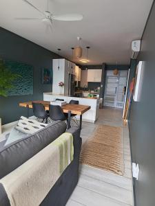 a living room with a couch and a table at Umdloti Holiday Resort 208 in Umdloti