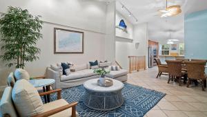 a living room with a couch and a table at 907 Mariners Club in Key Largo