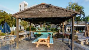 a pavilion with a ping pong table and benches at B105 Moon Bay in Key Largo