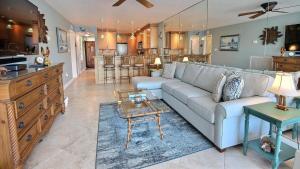 a large living room with a couch and a table at B307 Moon Bay in Villa Verde