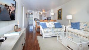 a living room with two couches and a table at B405 Moon Bay in Key Largo