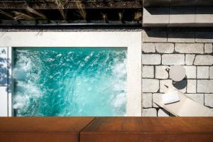 a picture of the ocean in a window at Casa de São Lourenço - Burel Panorama Hotel - member of Relais & Châteaux in Manteigas