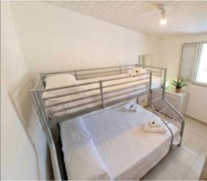 a bedroom with two bunk beds in a room at I Venti di Vulcano in Vulcano