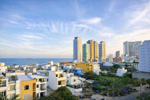 a view of a city with buildings and the ocean at Seaflow Staycation in Danang
