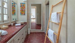 a bathroom with a sink and a mirror and a ladder at Villa NoYa in Oualidia +30 photos