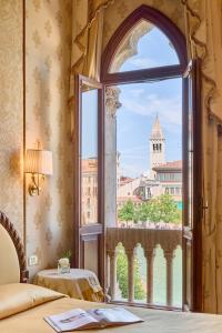 a room with a window with a view of a building at Hotel Palazzo Stern in Venice