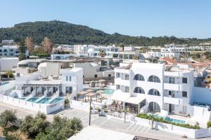 an aerial view of a city with white buildings at Alexander Studios & Suites - Adults Only in Faliraki