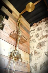 a light hanging from the ceiling of a room at Le Ptit Mas Yourte ou Logicube in Salernes