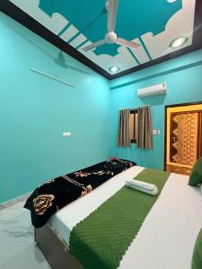 a bedroom with a bed with a ceiling at Keshav Vatika Palace - 800 meter Ram Mandir in Ayodhya +18 photos