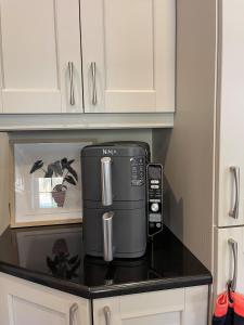a coffee maker on a counter in a kitchen at Ambermay House in Armagh +4 photos