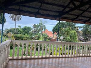 a view from the balcony of a house at Happy Fish Villa in Entebbe +17 photos