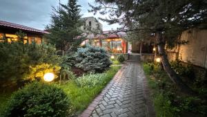 a stone path in front of a house at night at Gatsby Ortosay in Orto-Say