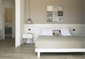 a bedroom with a bed and a pendant light at Residence Dolce Vita in San Benedetto del Tronto +69 photos