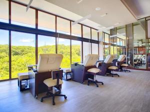 an office with a row of chairs and tables and windows at Armony Marival Resort & Spa Punta de Mita - MGallery collection in Punta Mita