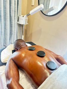 a statue of a man laying in a hospital bed at The Social in Burgersfort