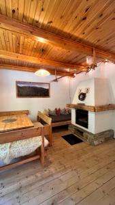 a room with a bed and a fireplace in it at Chalupa pri potoku in Zuberec +28 photos